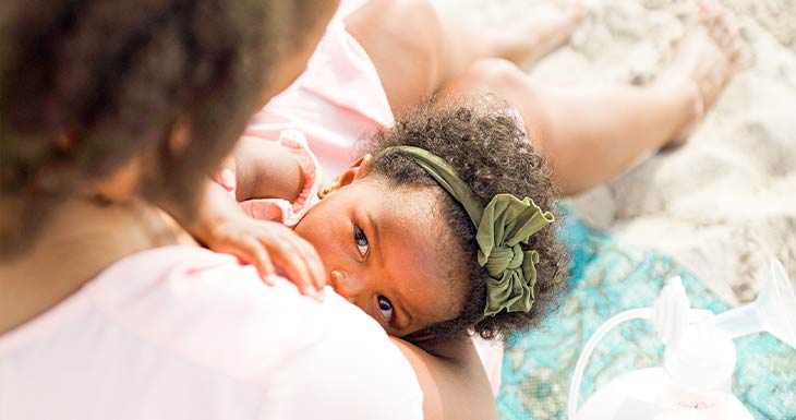 baby latching on mom